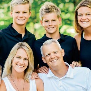 Phil Andrew and his family posing for a photo
