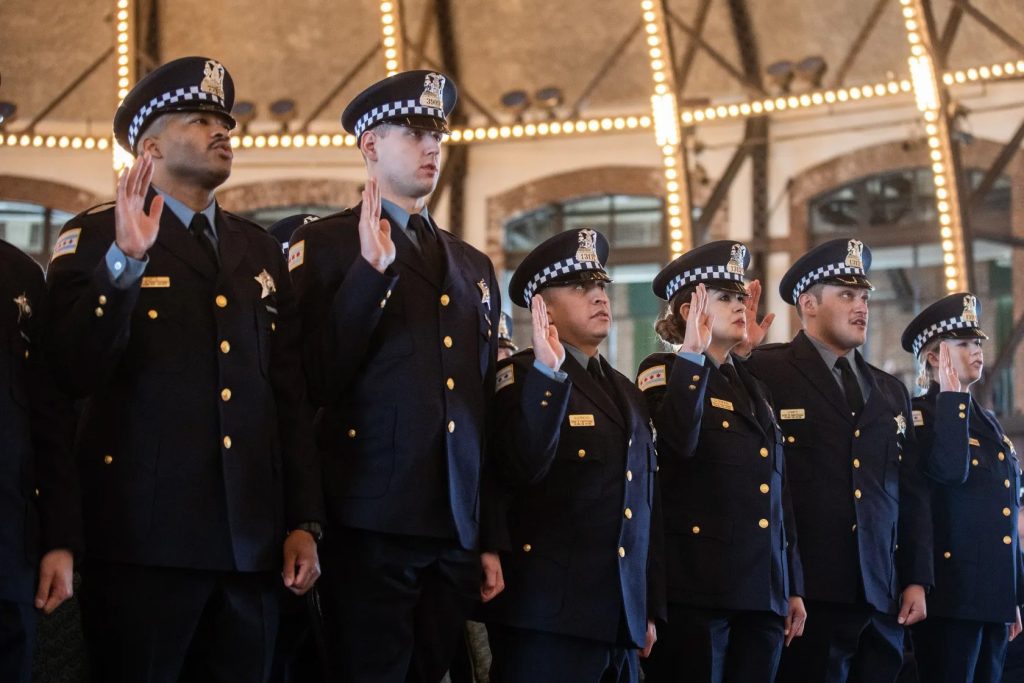 New Chicago Police Department officers take an oath during the graduation and promotion ceremony at Navy Pier on March 29. Pat Nabong/Sun-Times
