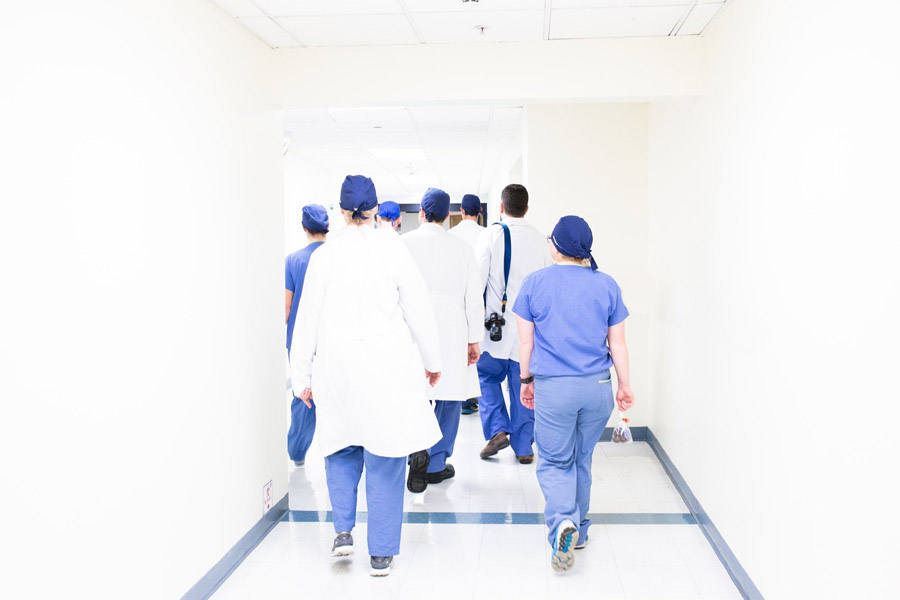 Healthcare Healthcare professionals walking in a hallway.