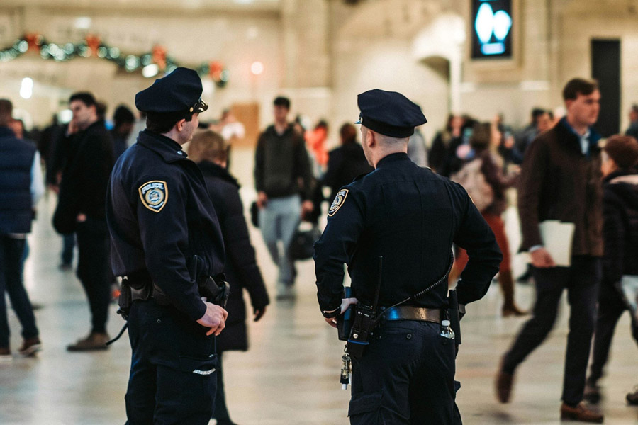 Law-Enforcement Two police officer watch a busy area.
